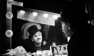 Charlie Chaplin looking into mirror